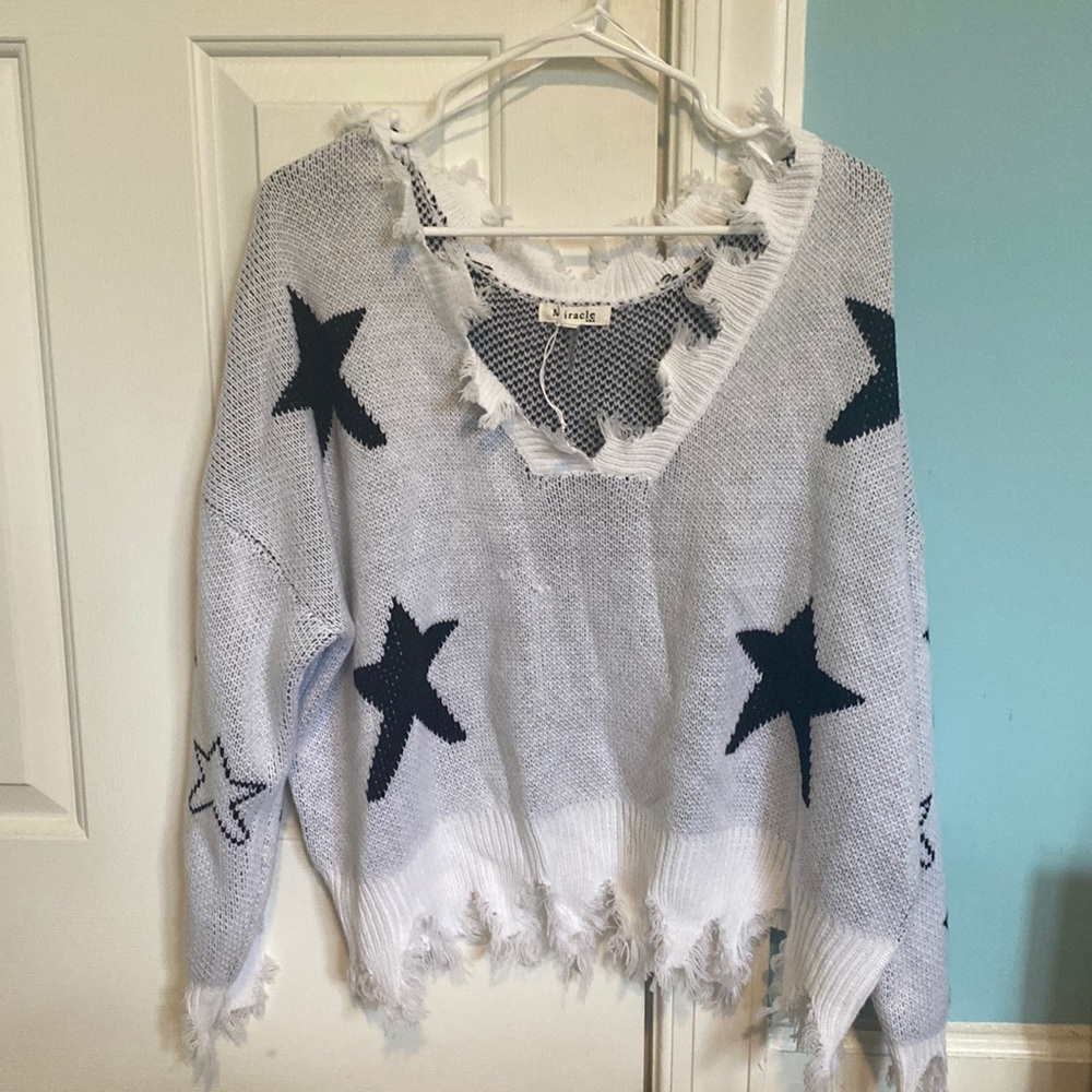 starry v neck sweater with tassels